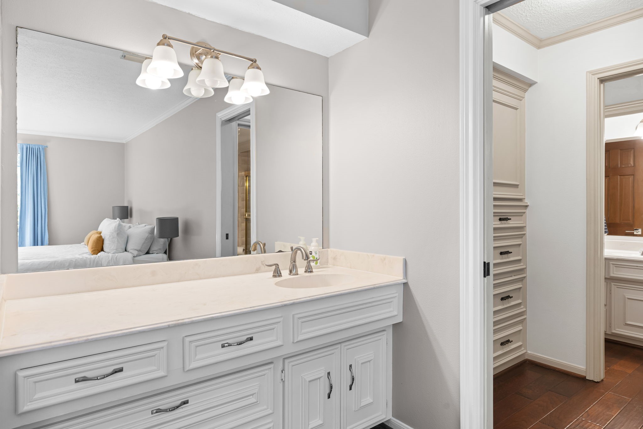 9410 Windrush Drive Spring, TX 77379 - Photo 40 of 50 a bathroom with a sink a mirror and a light fixture