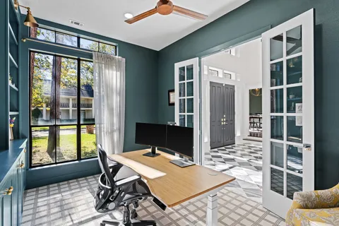 a workspace with furniture and window