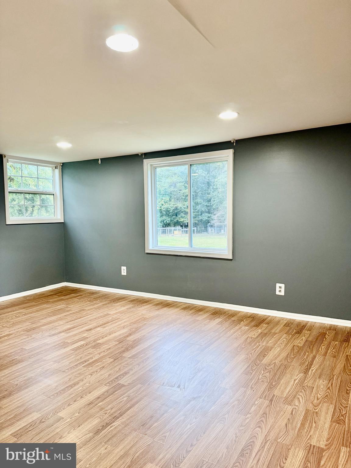 722 Hartwood Road Fredericksburg, VA 22406 - Photo 13 of 28 a view of an empty room with wooden floor and a window