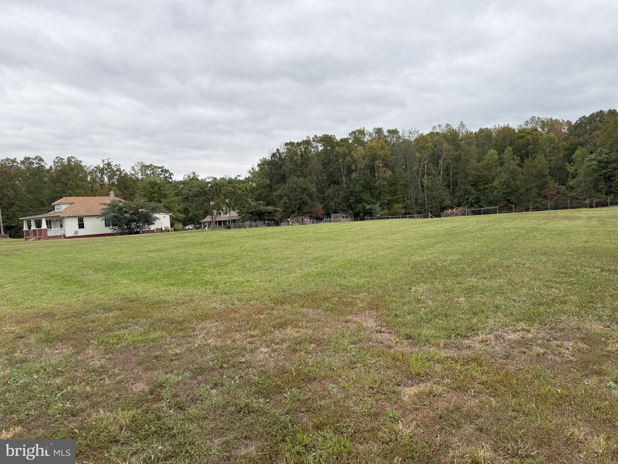 722 Hartwood Road Fredericksburg, VA 22406 - Photo 27 of 28 a view of a field with an trees in the background