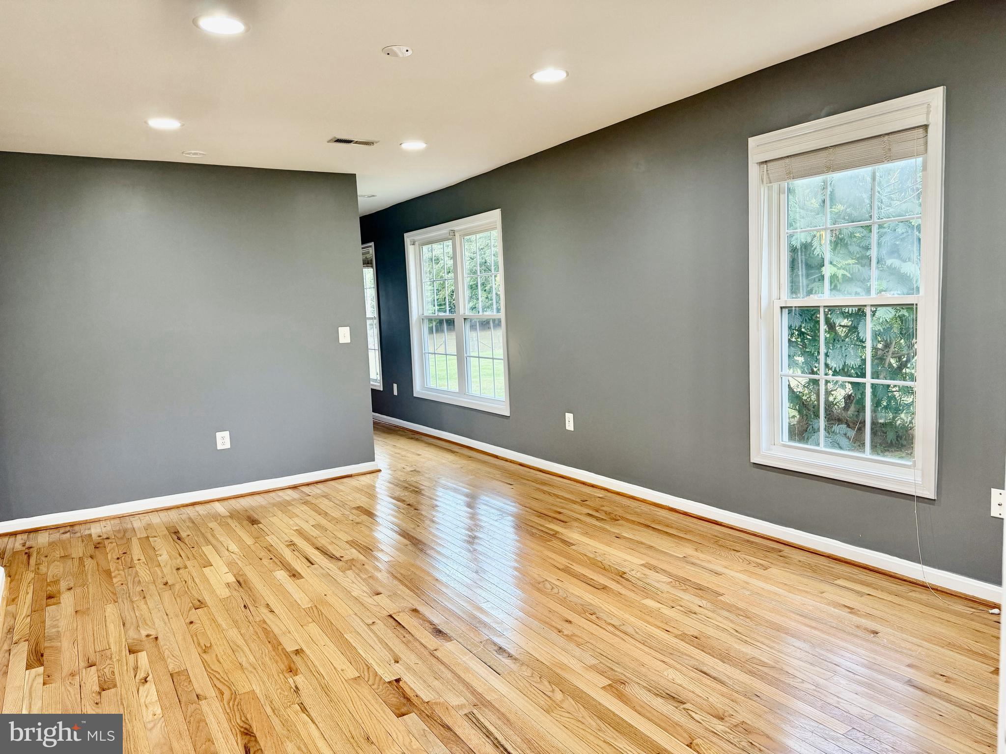 722 Hartwood Road Fredericksburg, VA 22406 - Photo 3 of 28 an empty room with wooden floor and windows