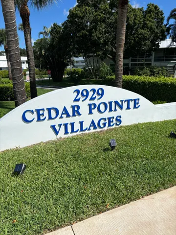 a view of outdoor space with signage and flags
