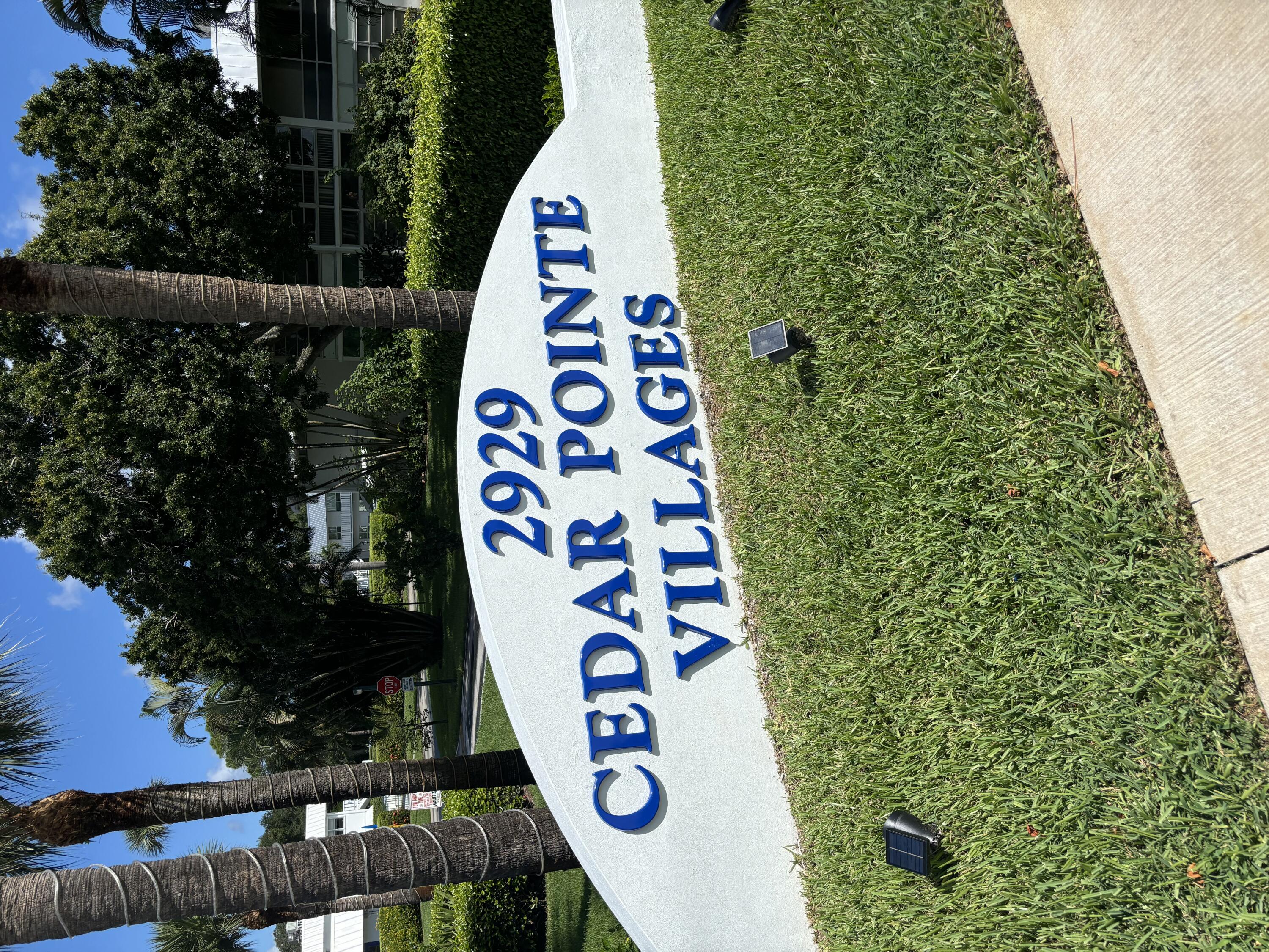 2929 Southeast Ocean Boulevard, Unit G6 Stuart, FL 34996 - Photo 1 of 10 a view of outdoor space with signage and flags