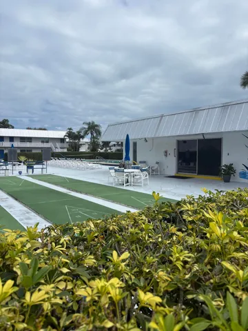 a view of a swimming pool with a yard