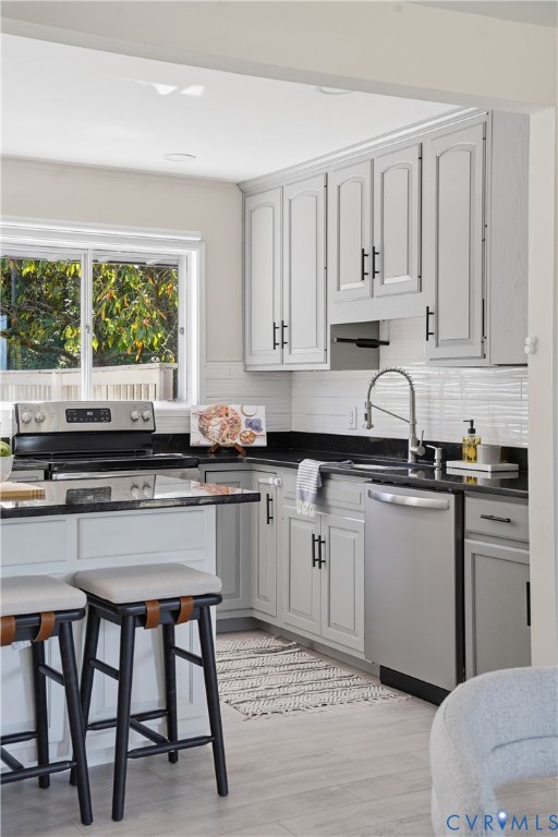 9207 Mapleway Road Richmond, VA 23229 - Photo 11 of 36 Kitchen featuring light gray cabinetry, dark count