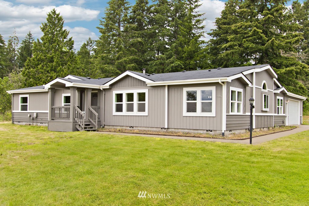 4836 163rd Lane Southwest Rochester, WA 98579 - Photo 1 of 1 a front view of a house with a yard