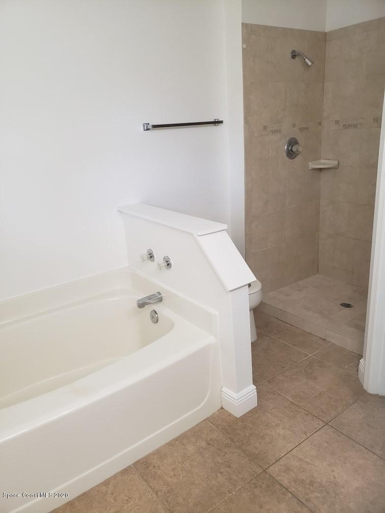1280 Seabold Road Southwest Palm Bay, FL 32908 - Photo 19 of 28 a bathroom with a bathtub and shower