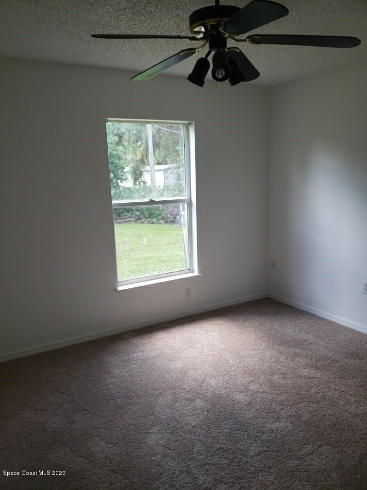 1280 Seabold Road Southwest Palm Bay, FL 32908 - Photo 22 of 28 an empty room with windows