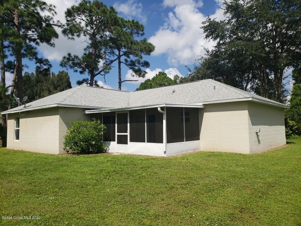 1280 Seabold Road Southwest Palm Bay, FL 32908 - Photo 4 of 28 front view of a house with a yard