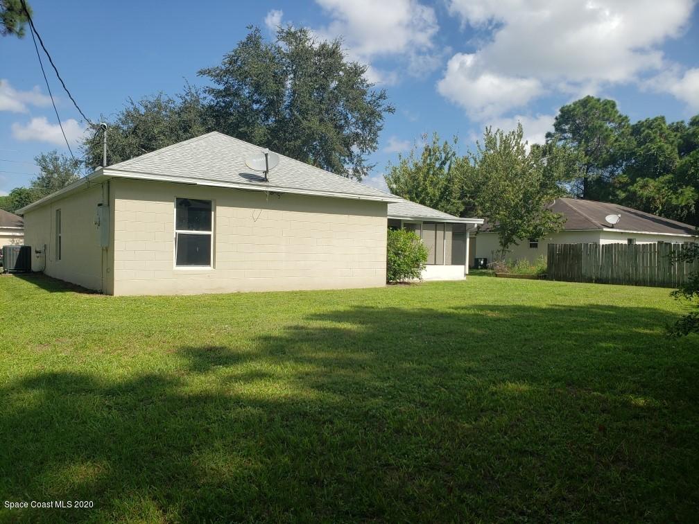 1280 Seabold Road Southwest Palm Bay, FL 32908 - Photo 5 of 28 a front view of house with yard and green space