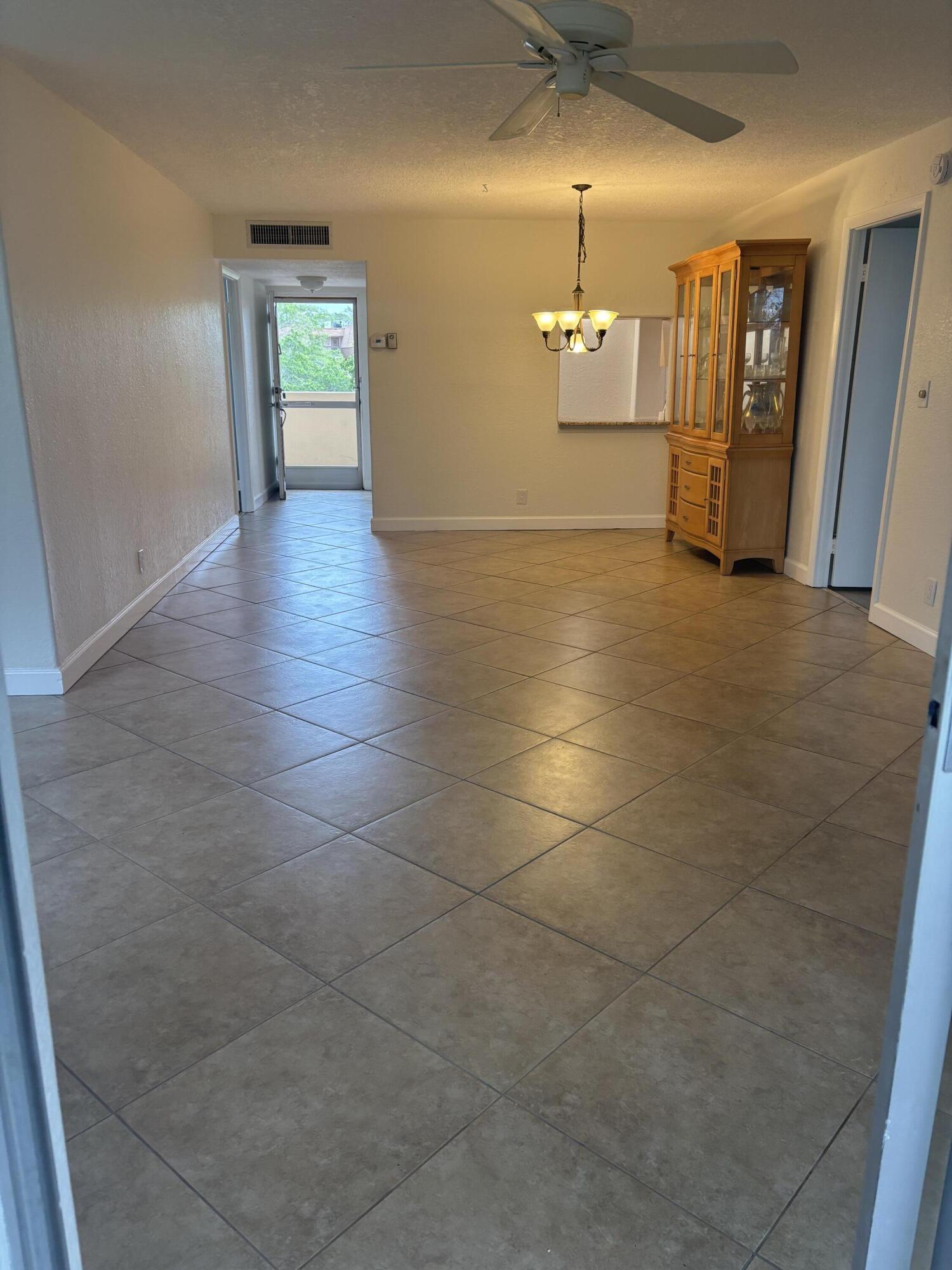 6461 Northwest 2nd Avenue, Unit 313 Boca Raton, FL 33487 - Photo 3 of 9 living and dining