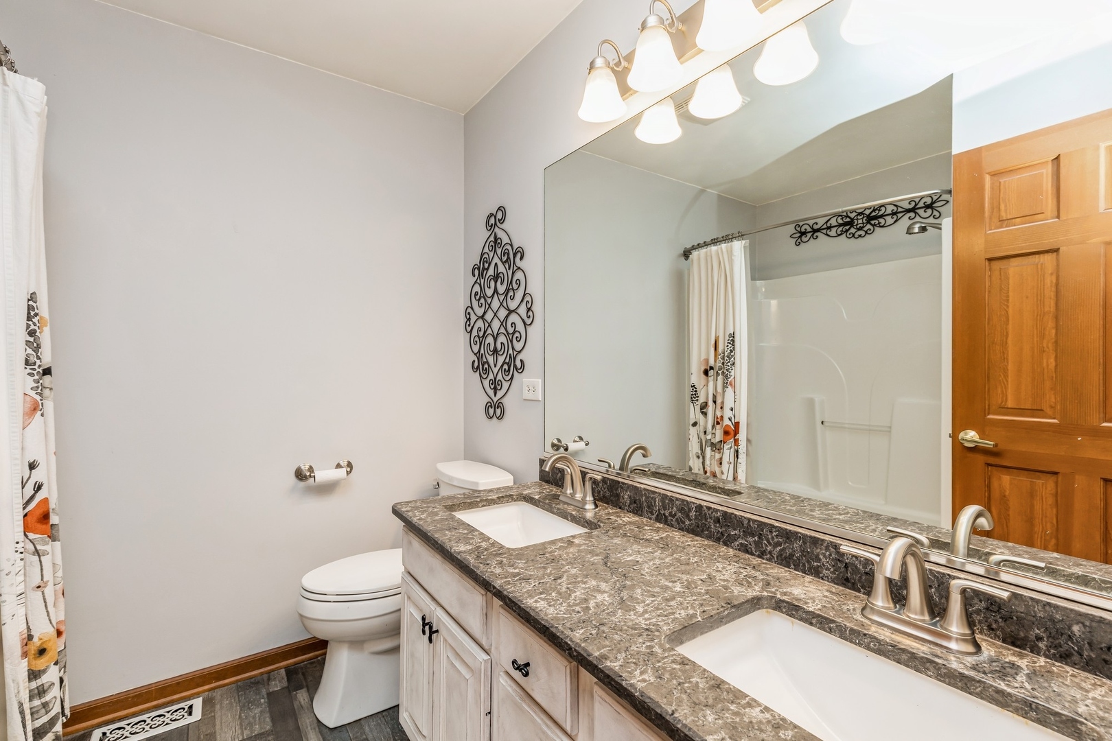 8N681 Edgewood Road Elgin, IL 60124 - Photo 17 of 31 a bathroom with a granite countertop double vanity sink mirror and toilet