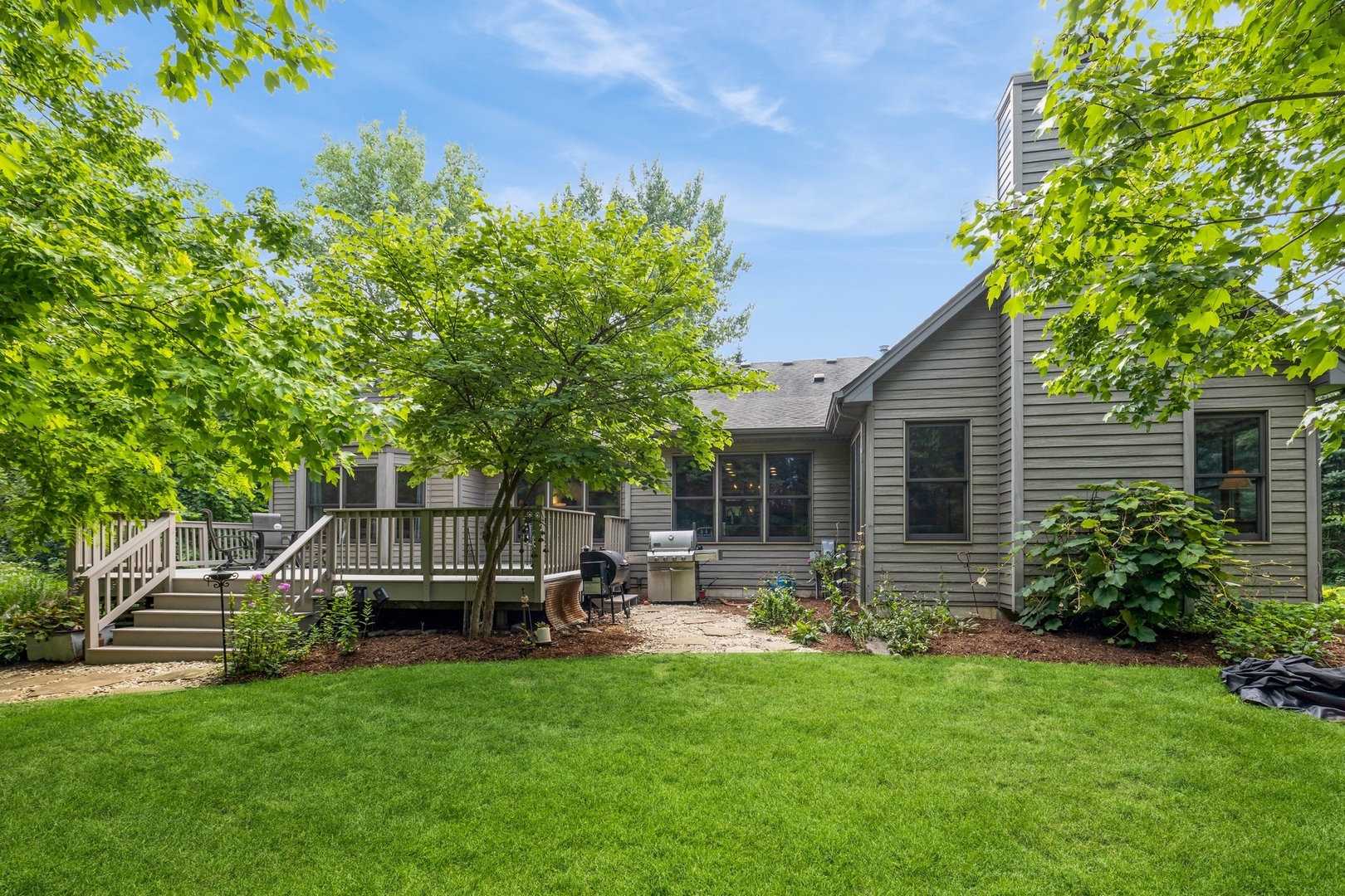 8N681 Edgewood Road Elgin, IL 60124 - Photo 2 of 31 a garden view with a seating space
