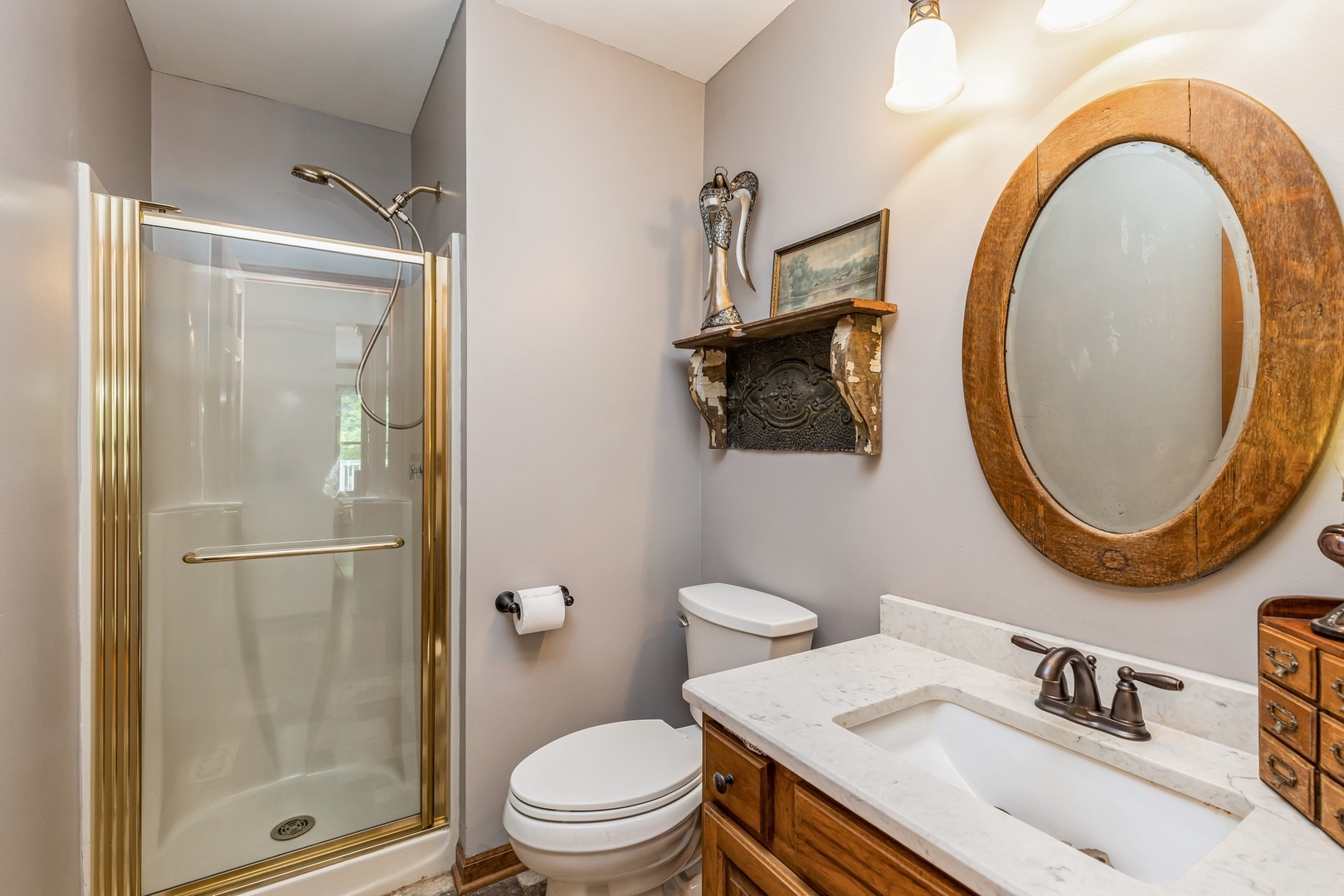 8N681 Edgewood Road Elgin, IL 60124 - Photo 21 of 31 a bathroom with a sink a toilet and a mirror