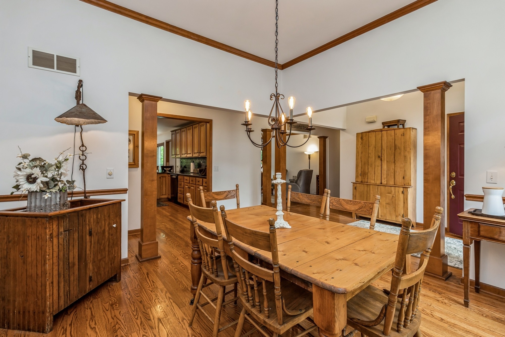 8N681 Edgewood Road Elgin, IL 60124 - Photo 5 of 31 a view of a dining room and livingroom with furniture wooden floor a chandelier