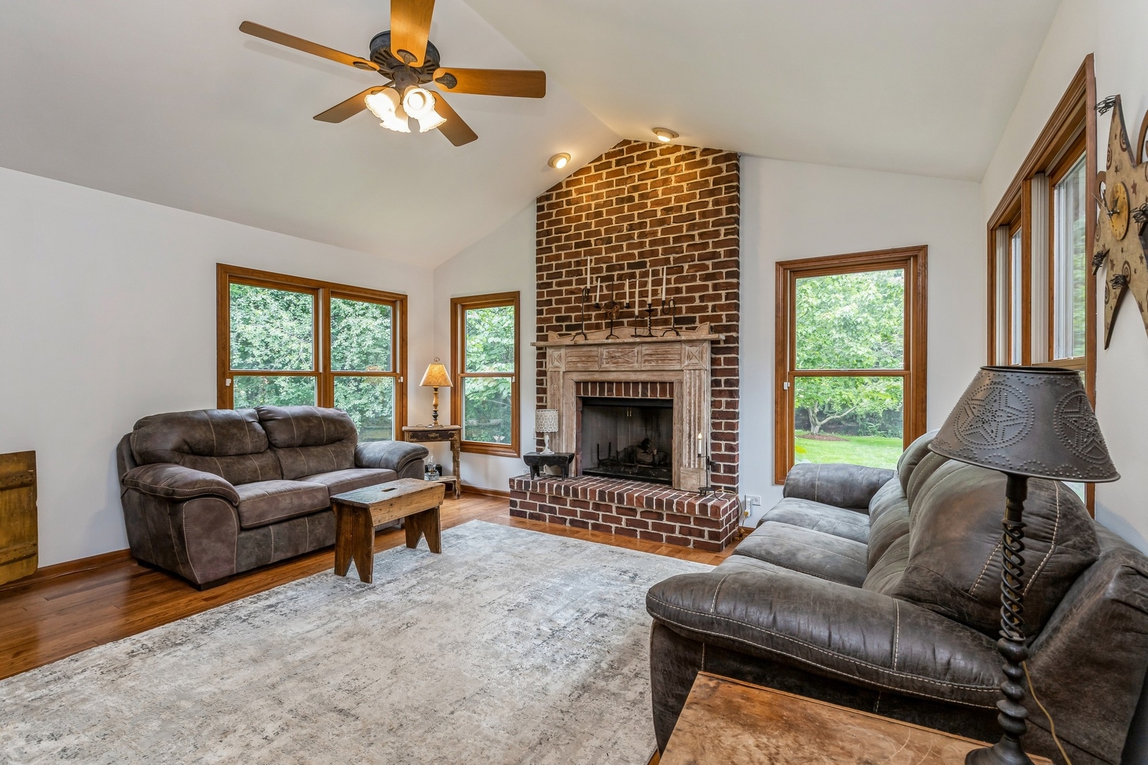 8N681 Edgewood Road Elgin, IL 60124 - Photo 10 of 31 a living room with furniture and a fireplace