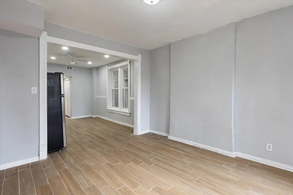 a view of hallway with wooden floor