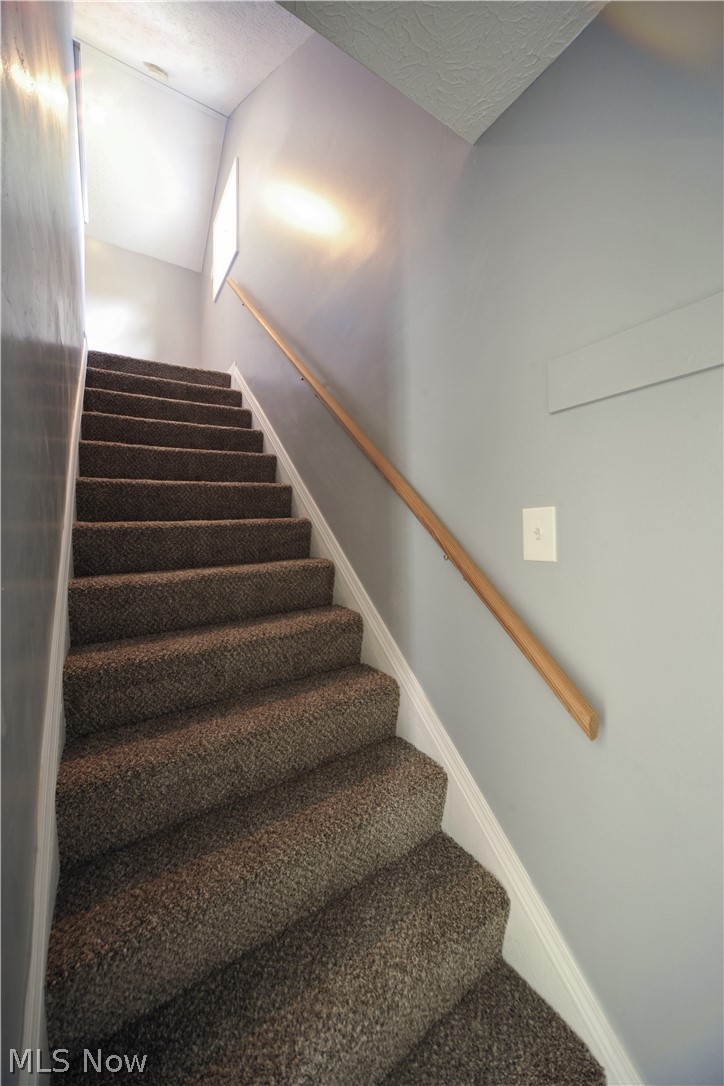 197 Struthers-Liberty Road Campbell, OH 44405 - Photo 15 of 27 Carpeted steps to huge second floor bedroom.