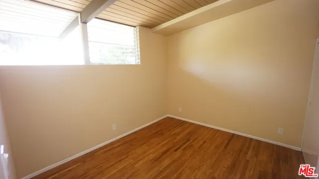 a kitchen with a stove and a refrigerator