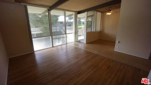 a kitchen with granite countertop a stove microwave and cabinets