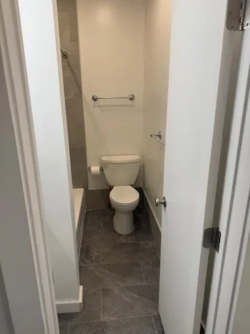 a bathroom with a toilet and a sink