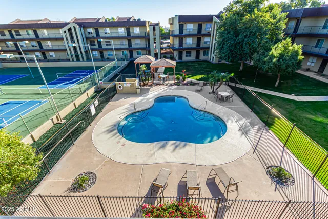 a view of a swimming pool with a patio
