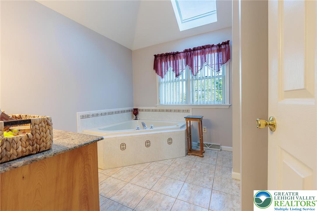 2170 Clearview Road Coplay, PA 18037 - Photo 37 of 75 Relax in this tranquil space featuring a corner soaking tub and natural light.