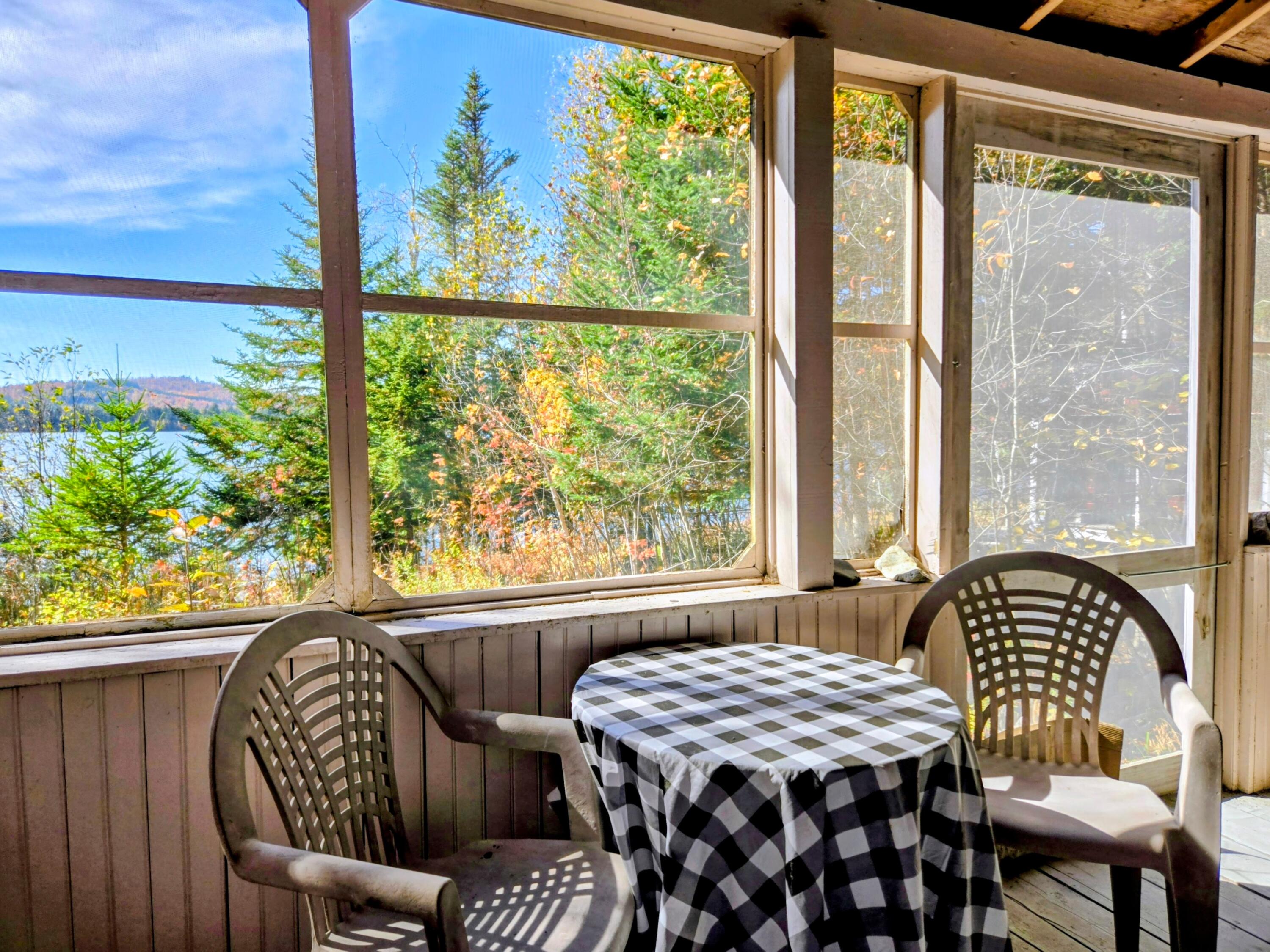 252 Quimby Pond Road Rangeley, ME 04970 - Photo 26 of 47 Screened Porched Overlooking Quimby Pond