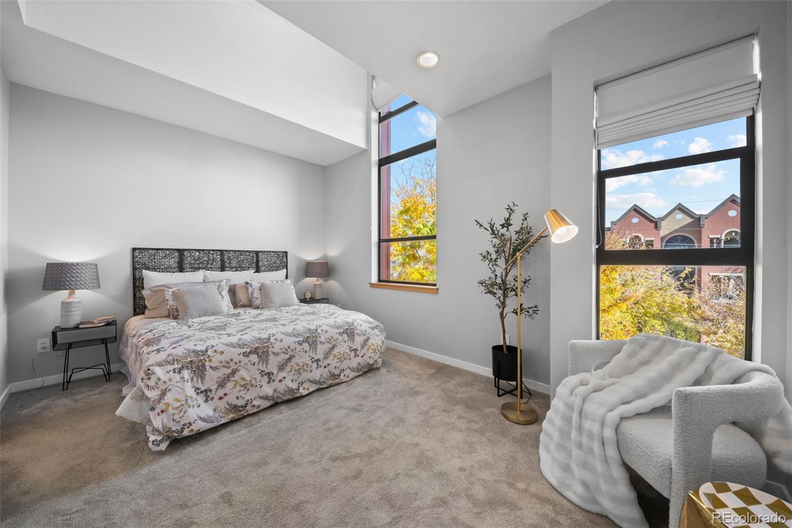 516 24th Street Denver, CO 80205 - Photo 14 of 42 a bedroom with a bed and a window