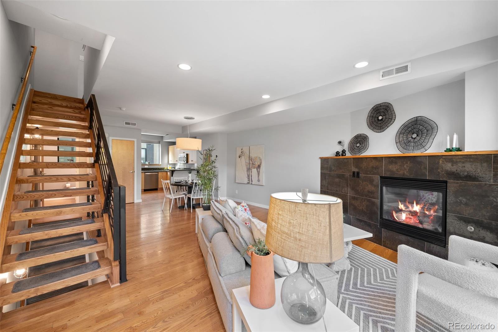 516 24th Street Denver, CO 80205 - Photo 6 of 42 a living room with furniture and a fireplace