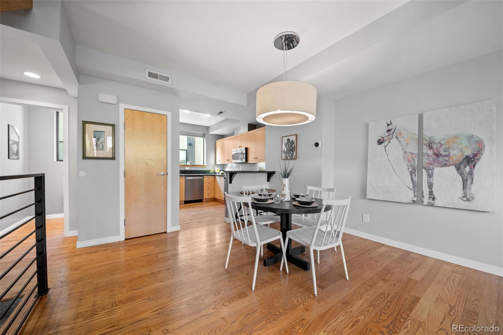516 24th Street Denver, CO 80205 - Photo 7 of 42 a view of a dining room with furniture and wooden floor