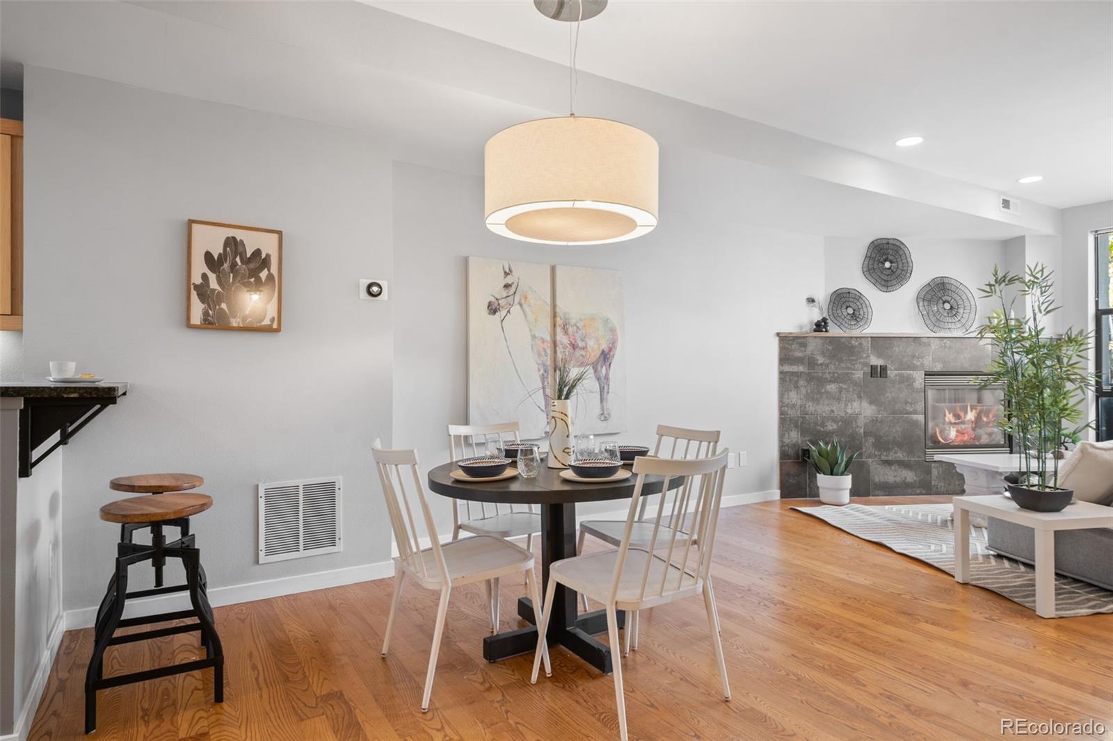 516 24th Street Denver, CO 80205 - Photo 9 of 42 a view of a dining room with furniture and wooden floor