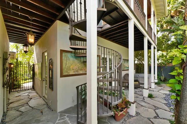 a view of balcony with wooden floor and outdoor seating
