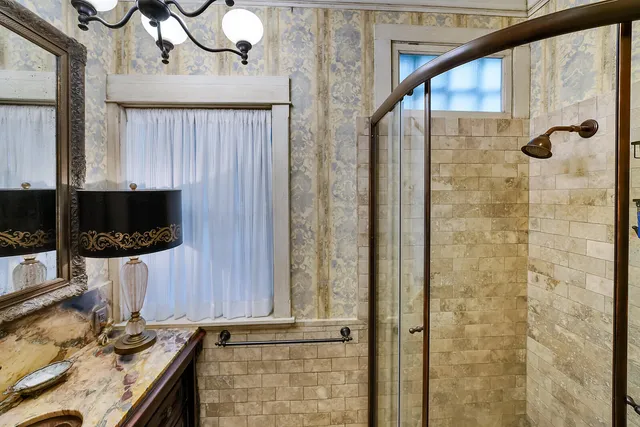 an aerial view of a house with yard and outdoor seating