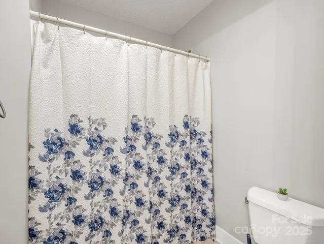 a view of storage and utility room with washer and dryer