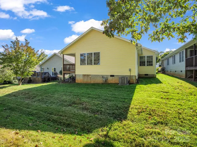 a view of a lake with a yard and trees
