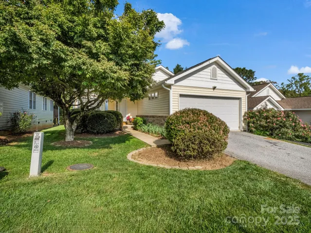 a view of a front of a house with a yard