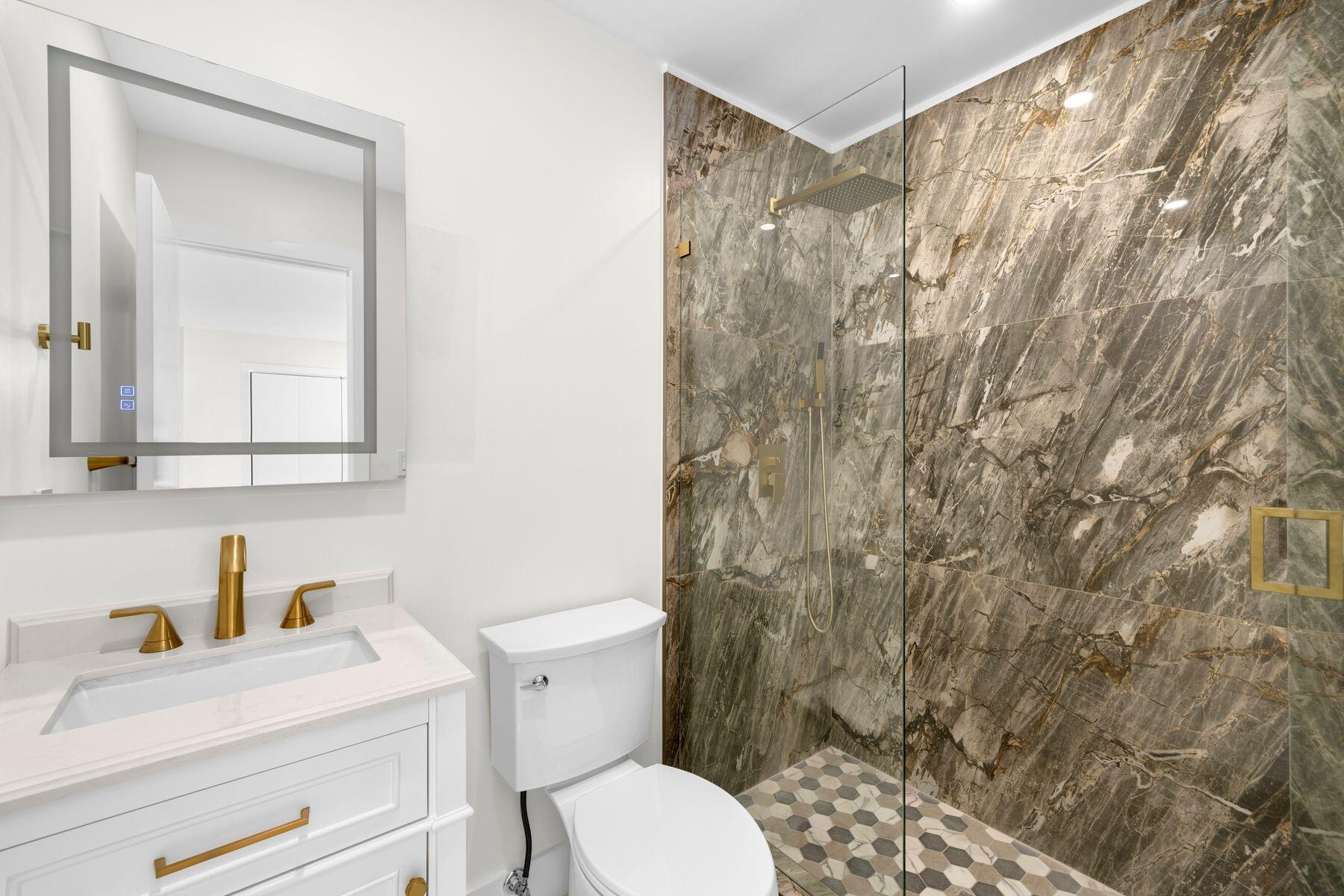 1367 Northwest 41st Street Miami, FL 33142 - Photo 15 of 20 a bathroom with a sink a toilet and a mirror