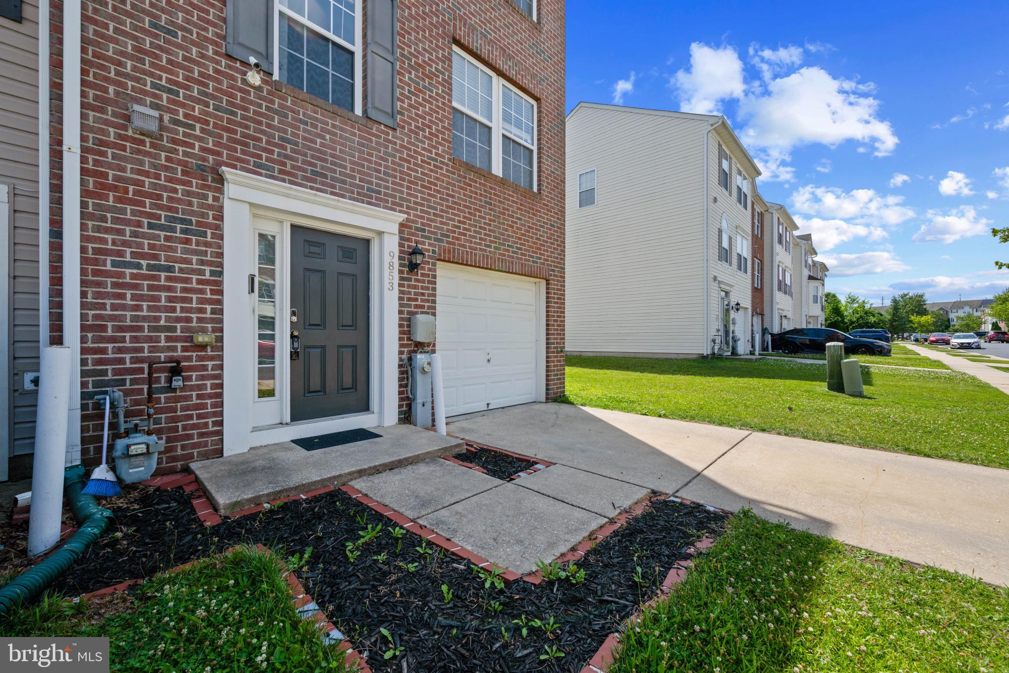 9853 Decatur Road Middle River, MD 21220 - Photo 36 of 37 Brick exterior featuring a paneled entry door with