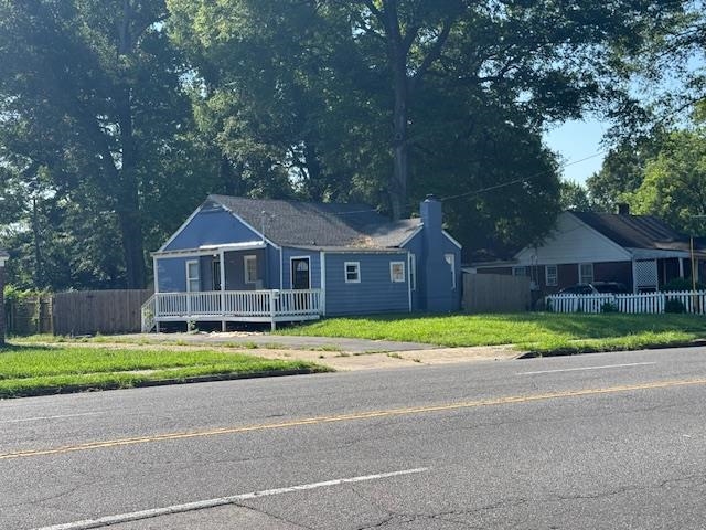 1688 Pendleton Street Memphis, TN 38114 - Photo 13 of 17 a front view of a house with a yard and garage