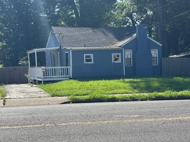 1688 Pendleton Street Memphis, TN 38114 - Photo 16 of 17 a front view of a house with a yard and garage