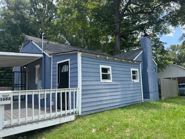1688 Pendleton Street Memphis, TN 38114 - Photo 2 of 17 a view of a house with a yard and a large tree