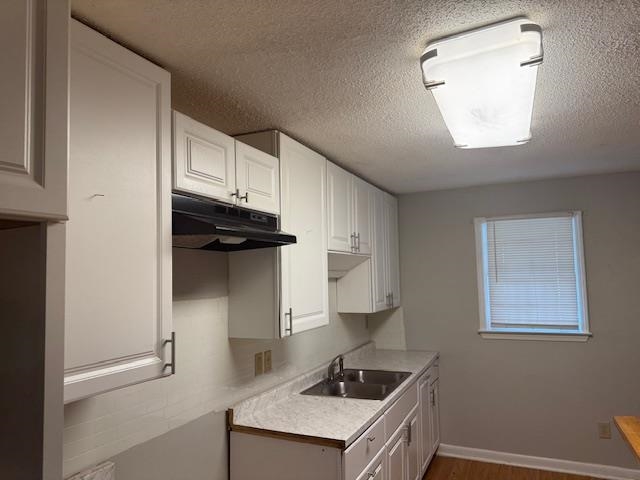 1688 Pendleton Street Memphis, TN 38114 - Photo 8 of 17 a kitchen with a refrigerator and a window