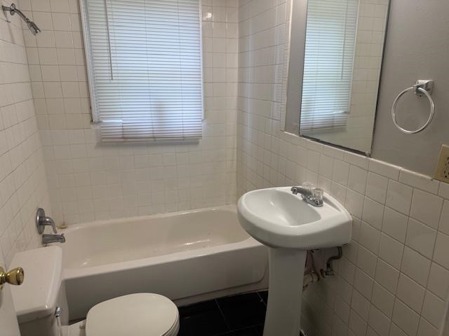1688 Pendleton Street Memphis, TN 38114 - Photo 10 of 17 a bathroom with a sink toilet a mirror and shower