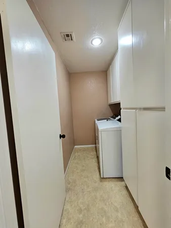 a view of a storage & utility room with washer and dryer