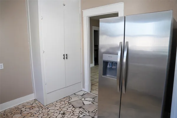 a bathroom with a glass shower door