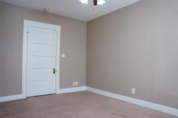 an empty room with closet area