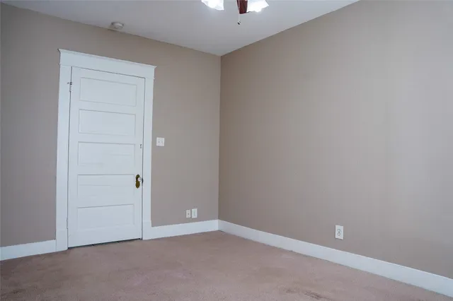 an empty room with closet area