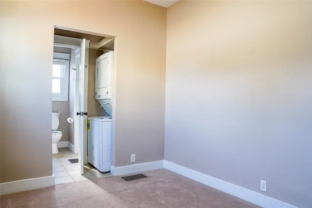 a view of a house with backyard and a tree