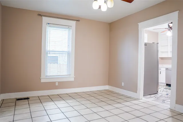 a view of an empty room and window